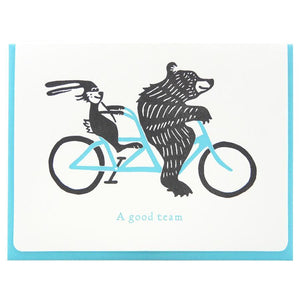 Letterpress card with bear and bunny on a tandem bike